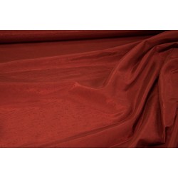 Tessuto sintetico unito di colore rosso mattone che mima l’aspetto della seta
