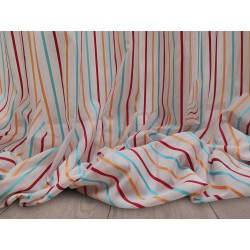 Tessuto a metraggio in mussola di cotone Polinesia color bianco a righe azzurre, arancioni e rosse